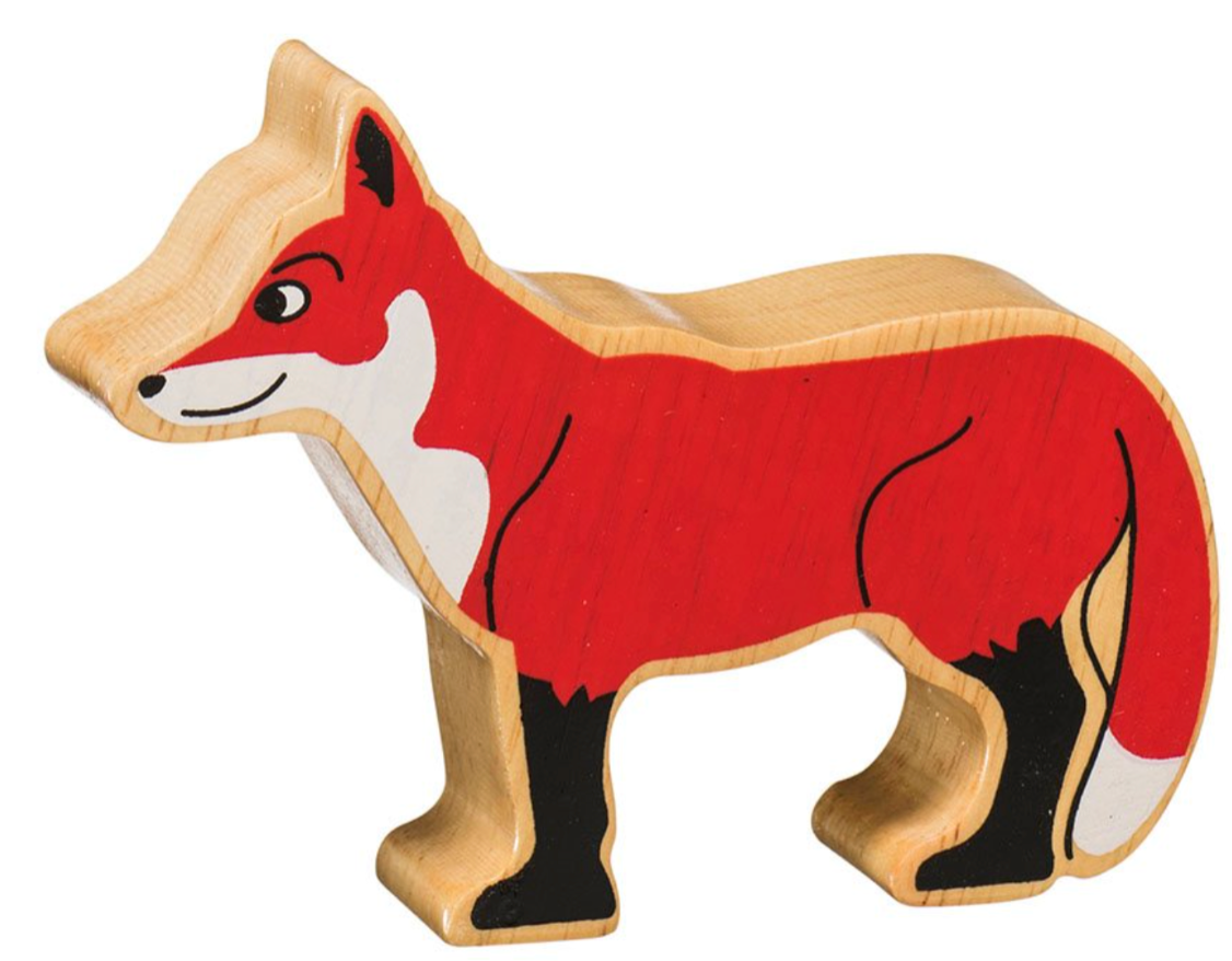 Wooden fox figurine on a white background