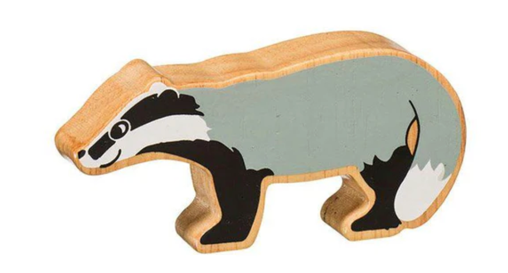 Wooden badger figure on a white background