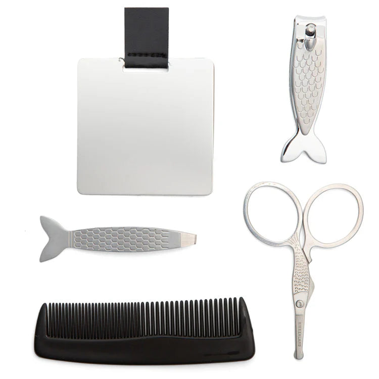 Set of grooming tools including a comb, scissors, and other items on a white background