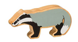 Wooden badger figure on a white background