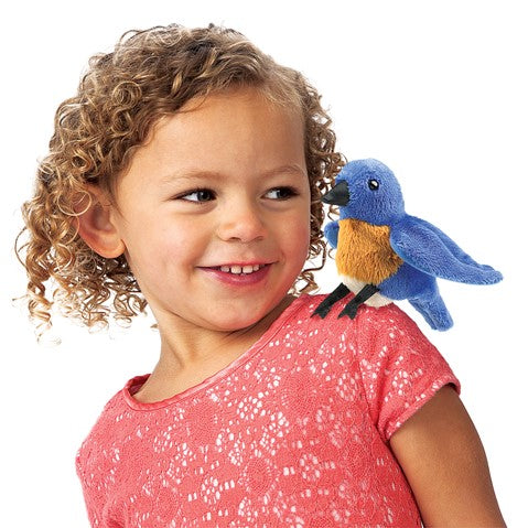 Folkmanis Mini Bluebird Finger Puppet on girls shoulder